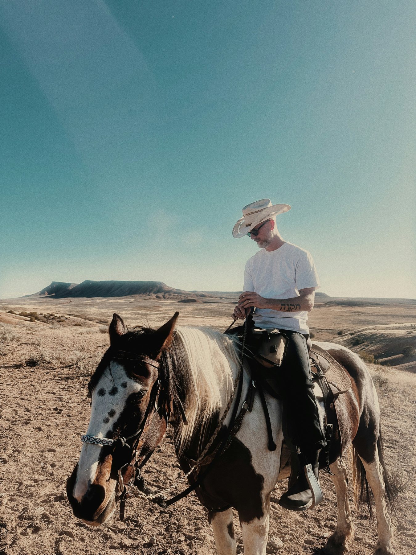 Nick de Partee on horseback in the high desert